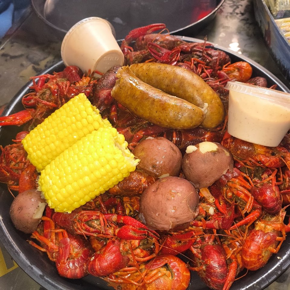 Fried seafood and sides served on white plates.